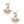Load image into Gallery viewer, Gold and white earrings with opal-like stones on a white background
