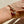 Load image into Gallery viewer, Gold bracelet with anchor design on a wrist against a neutral background
