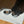 Load image into Gallery viewer, Dog eating from a bowl on a 'unikook' branded mat on a wooden floor.
