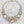 Load image into Gallery viewer, Gold necklace with large crystal beads on a dark surface
