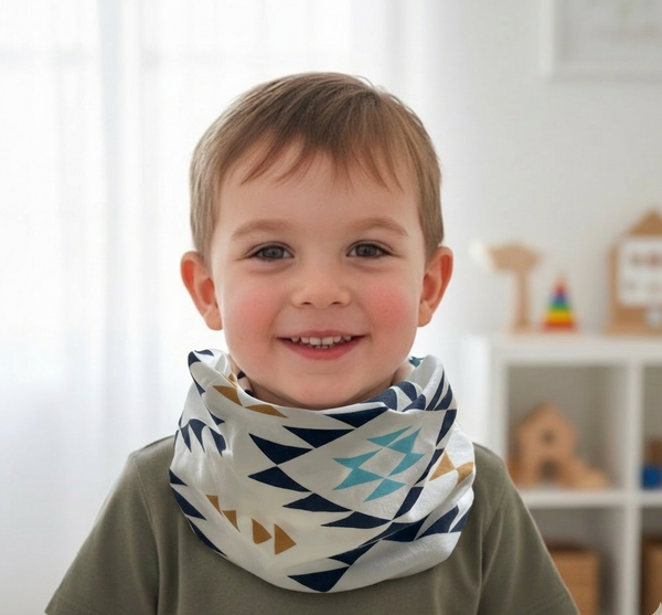 Child wearing a patterned scarf in a room with toys on shelves