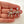 Load image into Gallery viewer, Bow-shaped earrings with rhinestones held between fingers on a light background
