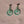 Load image into Gallery viewer, Pair of green earrings on a beige background with 'uniklook' branding.

