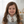 Load image into Gallery viewer, Child wearing a bib with dreamcatcher design in a home setting
