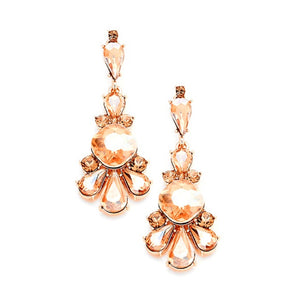 Rose gold earrings with clear gemstones on a white background