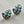 Load image into Gallery viewer, Pair of decorative earrings with blue and silver design on a light gray background
