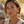 Load image into Gallery viewer, Woman wearing large green earrings with a natural background
