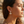 Load image into Gallery viewer, Woman wearing earrings with a blurred beach background
