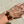 Load image into Gallery viewer, Gold bracelet with cat-shaped charms on a wrist against a neutral background
