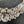 Load image into Gallery viewer, Close-up of a decorative brooch with crystals on a dark background

