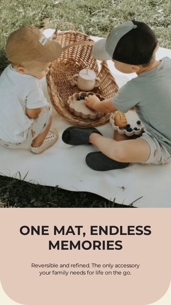 Two children sitting on a mat outdoors with a basket of items, text overlay 'One Mat, Endless Memories'.
