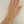 Load image into Gallery viewer, Gold bracelet on a hand against a plain background
