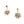 Load image into Gallery viewer, Gold sunburst earrings with clear gemstones on a light gray background
