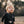 Load image into Gallery viewer, Child wearing a black outfit with star patterns outdoors
