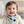 Load image into Gallery viewer, Baby wearing a colorful bib with a neutral background
