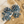 Load image into Gallery viewer, Pair of silver and blue beaded earrings on a textured surface
