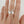 Load image into Gallery viewer, Silver crown-shaped ring on a finger against a plain background
