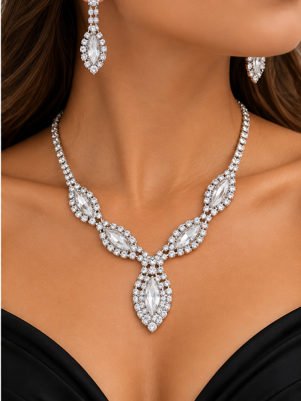Clear rhinestone necklace and matching earrings worn by a woman