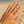 Load image into Gallery viewer, Hand wearing two diamond rings on a beach
