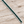 Load image into Gallery viewer, Emerald green crystal tennis bracelet on pale rustic wood
