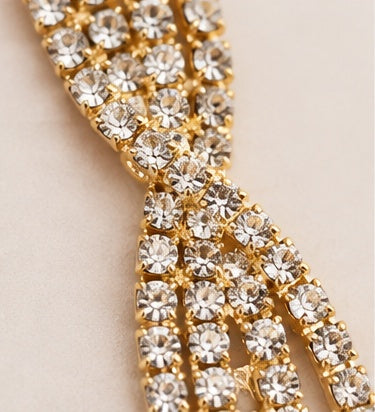 Gold crystal statement earrings close up