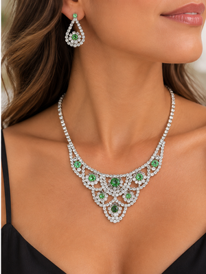 Green crystal necklace and earrings worn by a woman