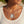Load image into Gallery viewer, A close-up of a woman wearing a layered silver necklace set. The top layer is a delicate chain with a small silver key-shaped charm, while the bottom layer is a thicker chain with a rectangular dog tag pendant engraved with the words 'BE BRAVE &amp; KEEP GOING'.
