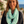 Load image into Gallery viewer, Woman wearing a light green infinity scarf with white patterns outdoors.
