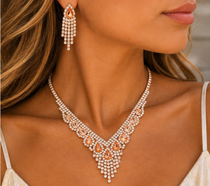 Peach crystal necklace and earrings worn by a model
