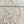Load image into Gallery viewer, A delicate silver-toned beaded necklace with a lobster clasp, laid flat on a light-colored, rustic wooden surface.
