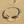 Load image into Gallery viewer, Silver bracelet with square charms on a sandy surface
