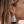 Load image into Gallery viewer, Close-up of a woman's ear wearing a decorative earring with tassels.
