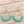 Load image into Gallery viewer, Turquoise beaded gold-tone hoop drop earrings on pale barn wood, 2.75 inches
