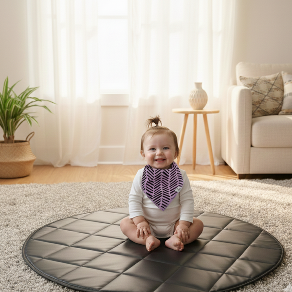 Baby sitting on a round mat in a living room