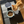Load image into Gallery viewer, Cat eating from a bowl on a black mat with 'Wetzel' branding
