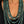 Load image into Gallery viewer, Long layered turquoise patina bead necklace and earrings worn with black top

