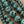 Load image into Gallery viewer, Close-up turquoise green dark marbled round beads
