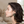 Load image into Gallery viewer, Woman wearing green earrings in a blurred indoor setting
