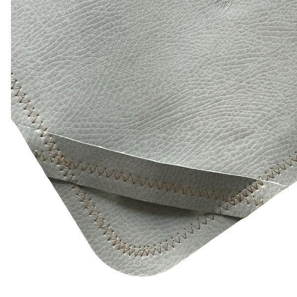 Gray side showing the handle on the backing.