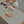 Load image into Gallery viewer, gray side vegan leather mat shown on an outside table as a placemat for a toddler.
