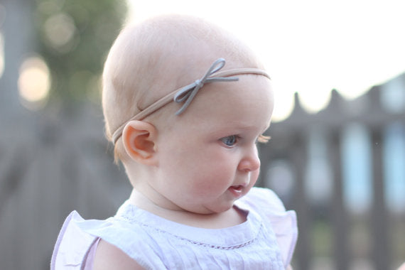 Sleek suede knot bow